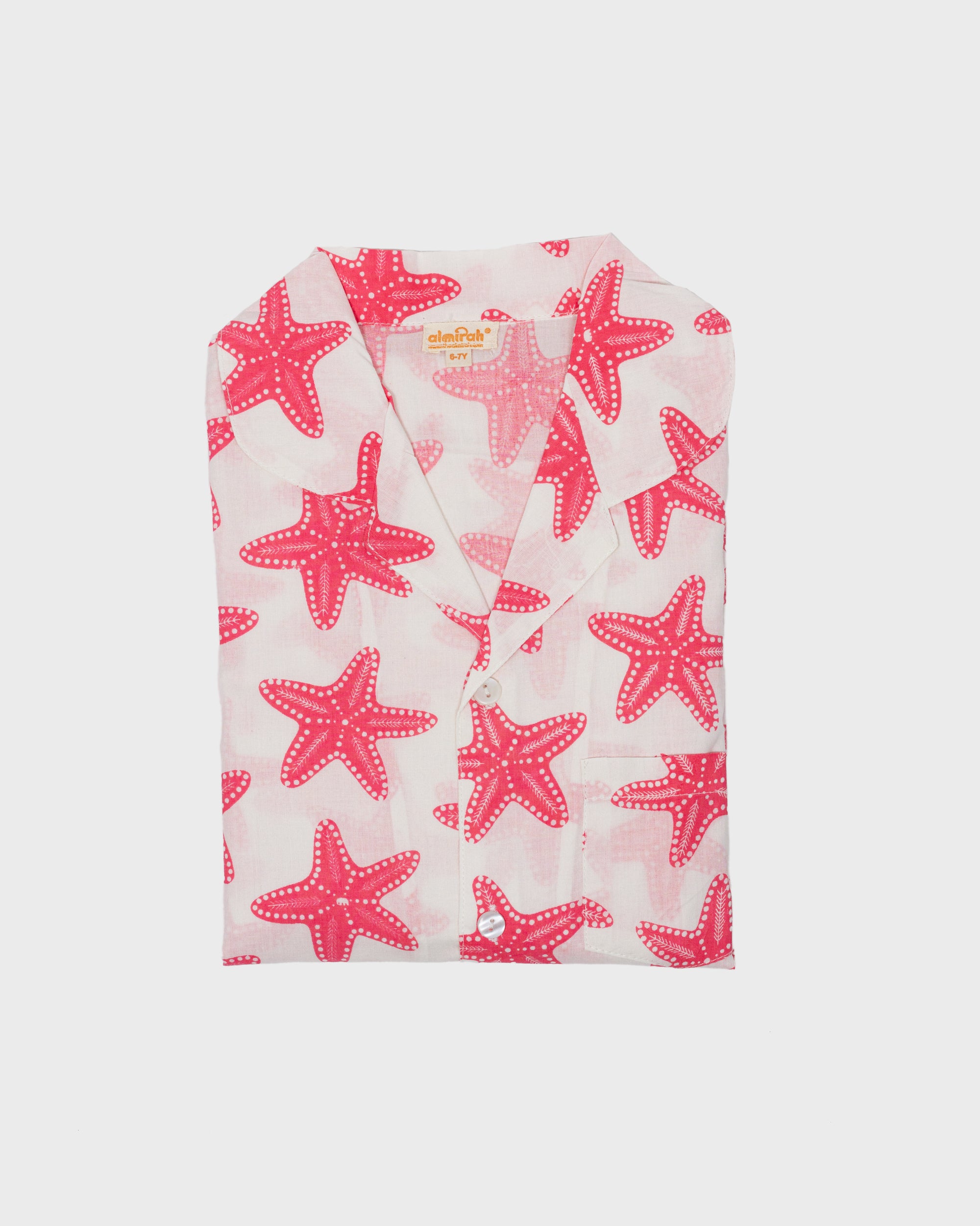 Folded pink starfish patterned fabric cutout