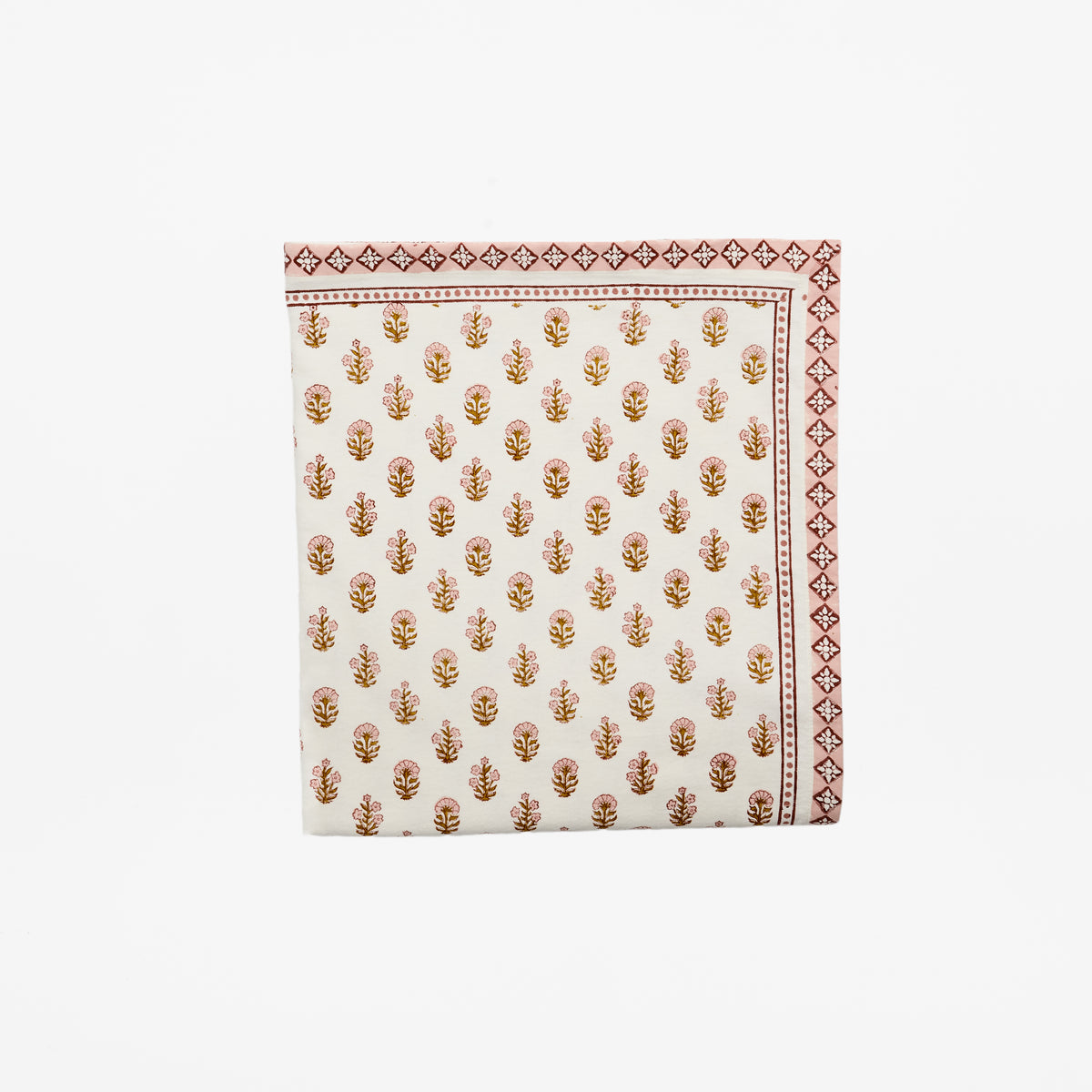 Hand block printed cotton tablecloth with rose pink and harvest gold ditsy floral and diamond border, by Rosie Dalia