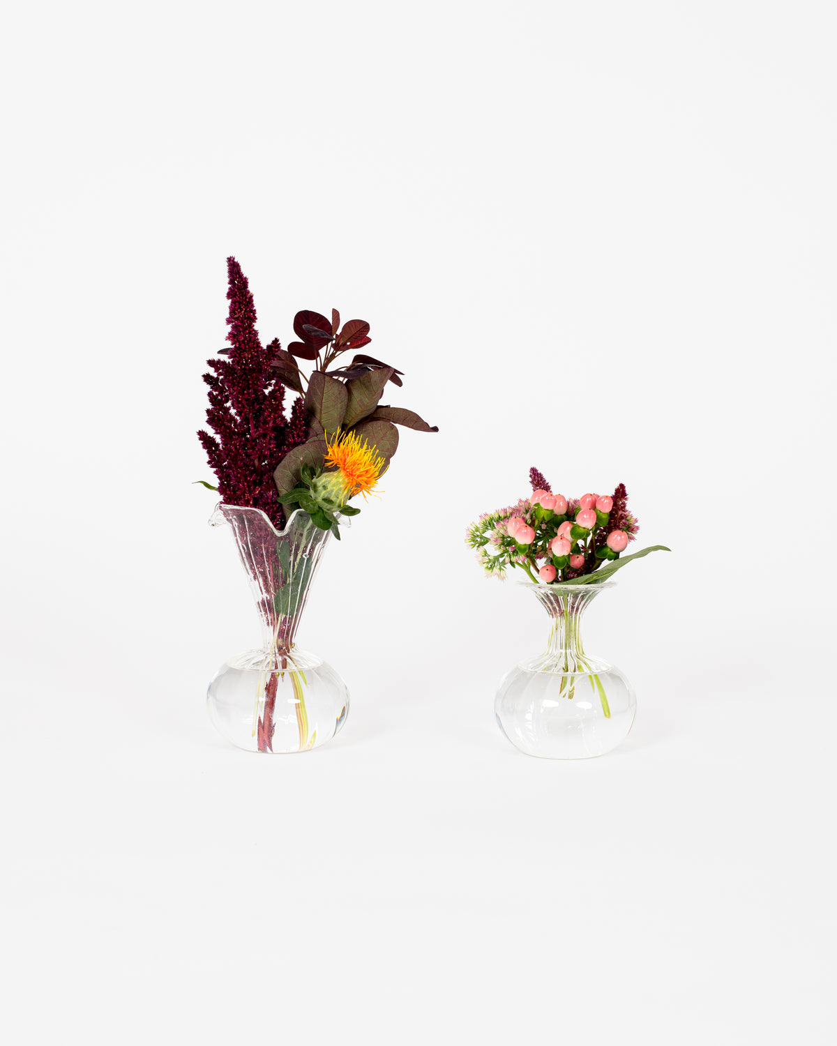 Glass bud vase set of 2, handblown, on a table