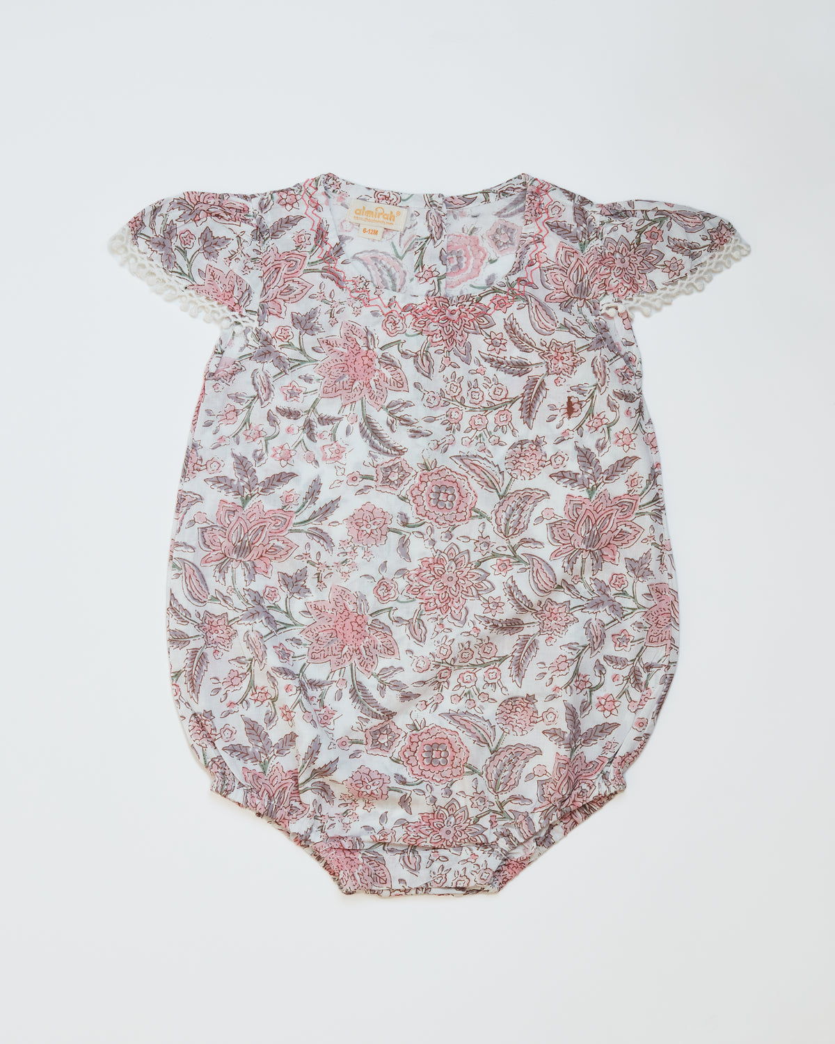 Cotton babygrow in blush floral print for babies, with frilled cap sleeves
