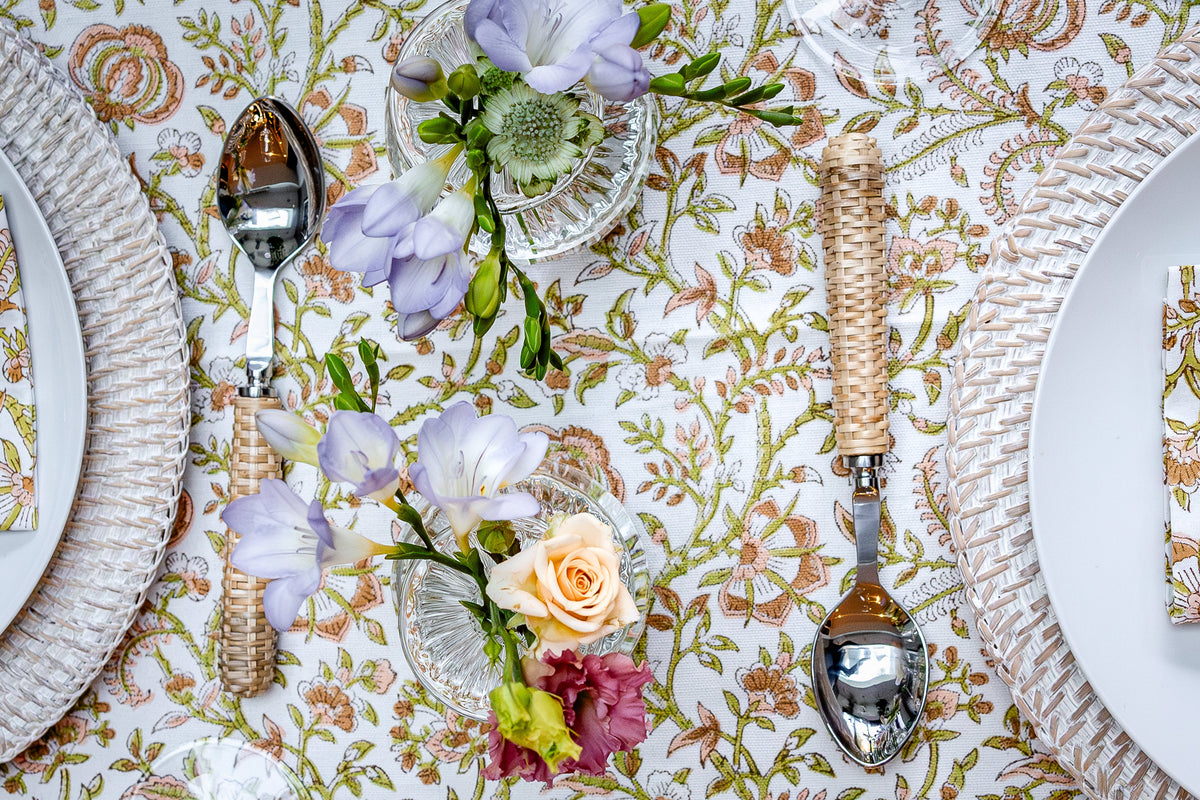 Glass bud vases styled with single stem flowers